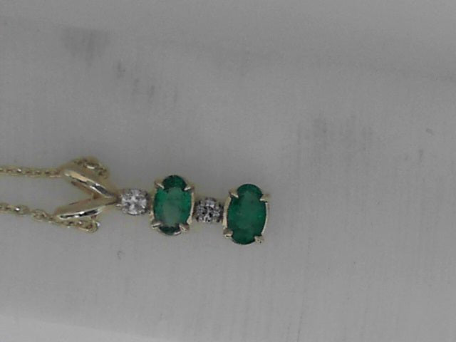 Vardy's Collection Oval Emerald and Round Diamond Free Form Pendant Necklace in 14K Yellow Gold (0.34ct)