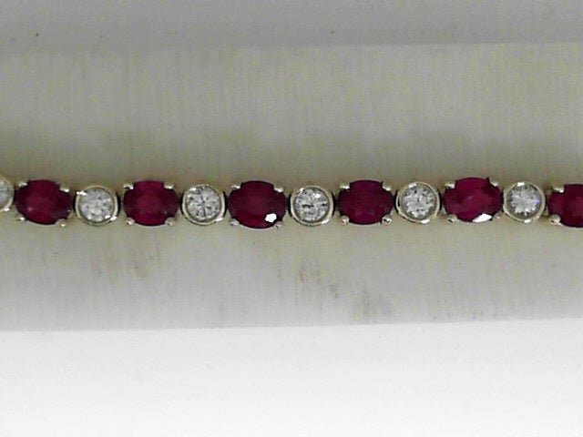 Vardy's Collection Oval Ruby and Round Diamond Tennis Bracelet in 14K Yellow Gold (10.56ctw)