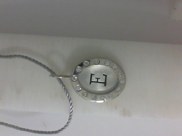 Vardy's Collection Round Diamond Charm Pendant in Sterling Silver